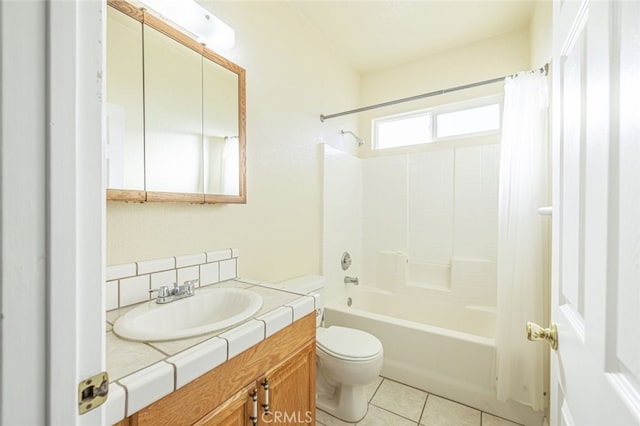 full bathroom featuring tile patterned flooring, vanity, toilet, and shower / tub combo with curtain