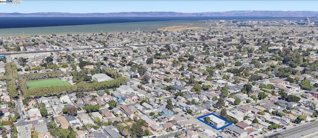 bird's eye view featuring a water and mountain view