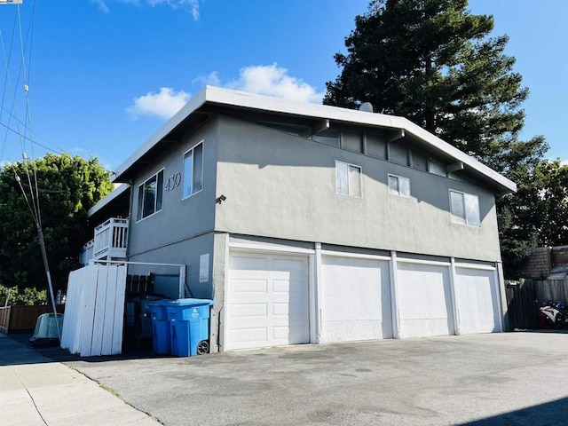 view of side of property with a garage