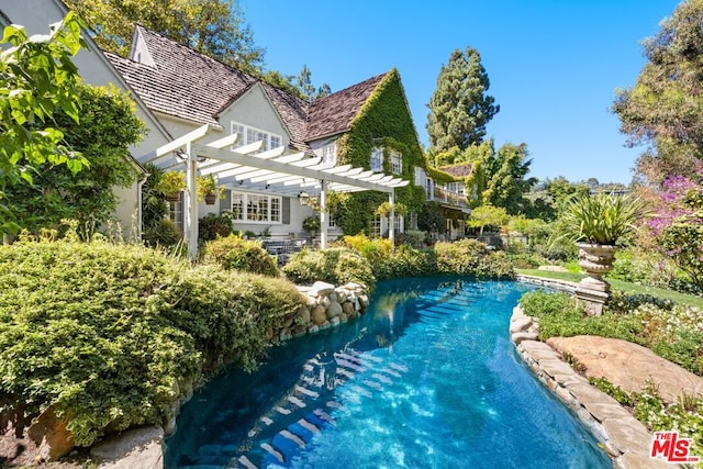 view of pool with a pergola