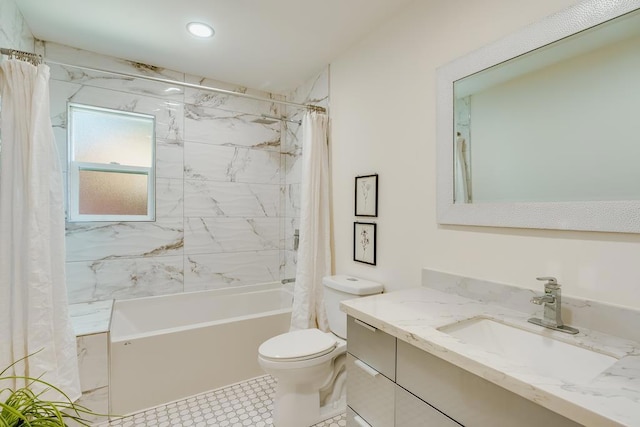 full bathroom with vanity, shower / tub combo, and toilet