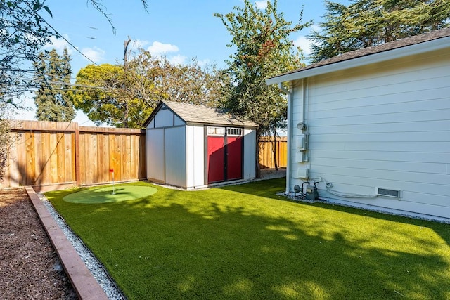 view of yard with a storage unit