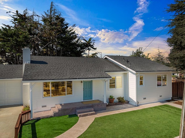 ranch-style house featuring a yard