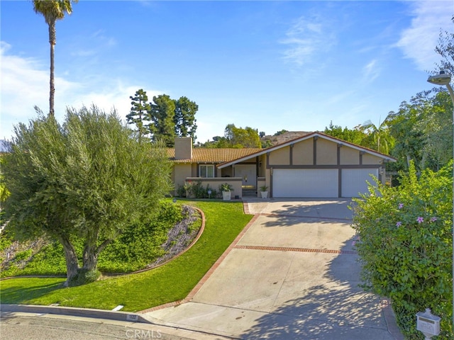 single story home with a garage and a front yard