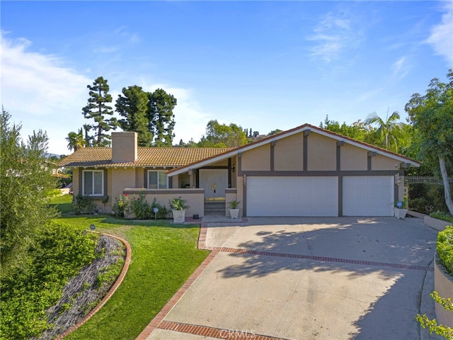 single story home with a front lawn and a garage