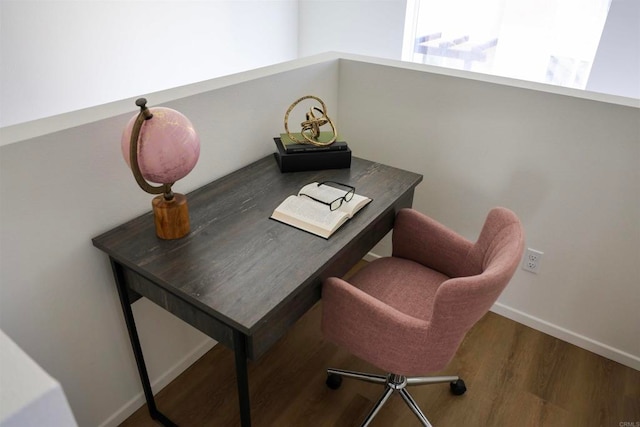 office space with wood-type flooring