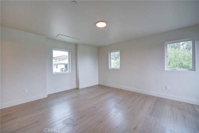 empty room with light hardwood / wood-style floors