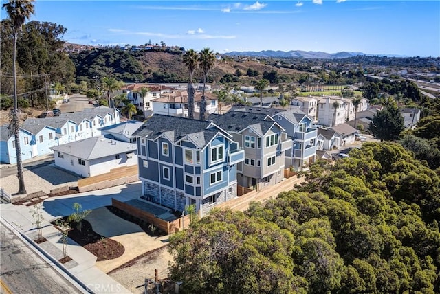 birds eye view of property with a mountain view