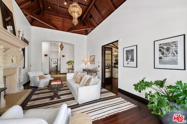 living room with a premium fireplace, dark wood-type flooring, high vaulted ceiling, and wood ceiling