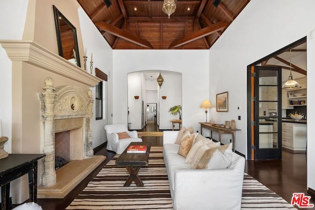 living room with high vaulted ceiling, wooden ceiling, and dark hardwood / wood-style floors