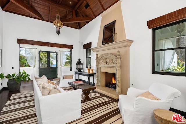 sitting room with hardwood / wood-style floors, high vaulted ceiling, french doors, and wooden ceiling