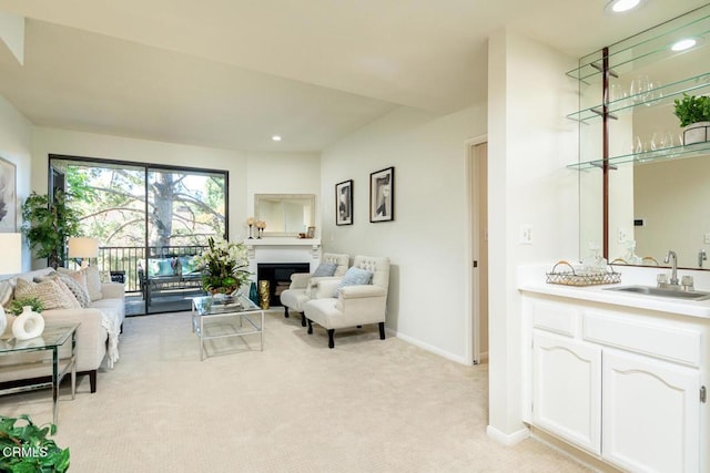 living room with light colored carpet and sink