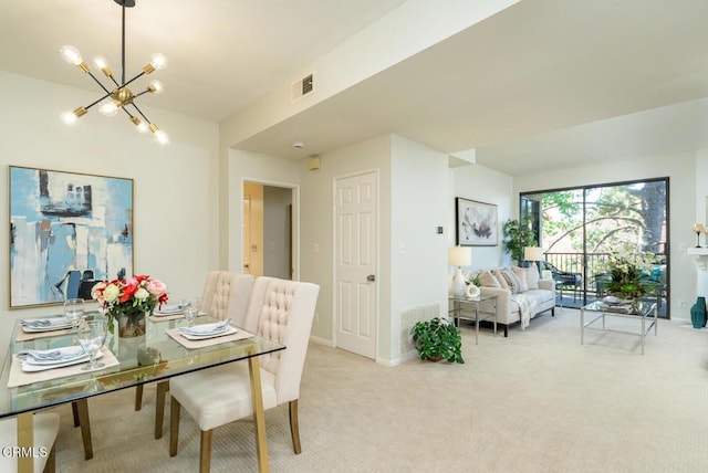 carpeted dining area with a notable chandelier