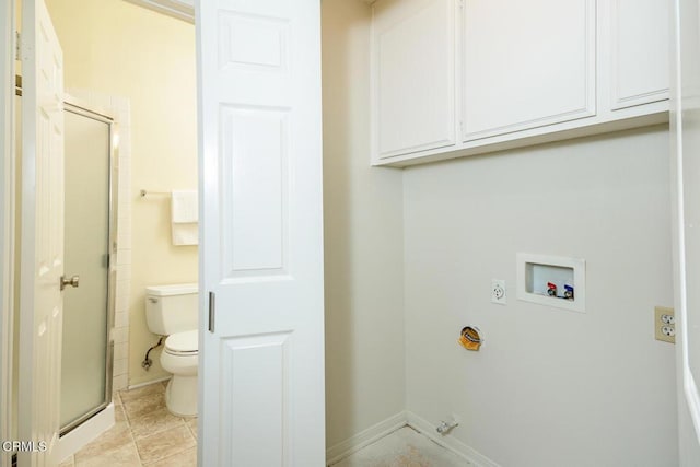 washroom featuring electric dryer hookup, hookup for a washing machine, and light tile patterned floors