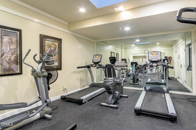 workout area featuring ornamental molding