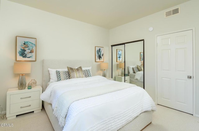 carpeted bedroom with a closet