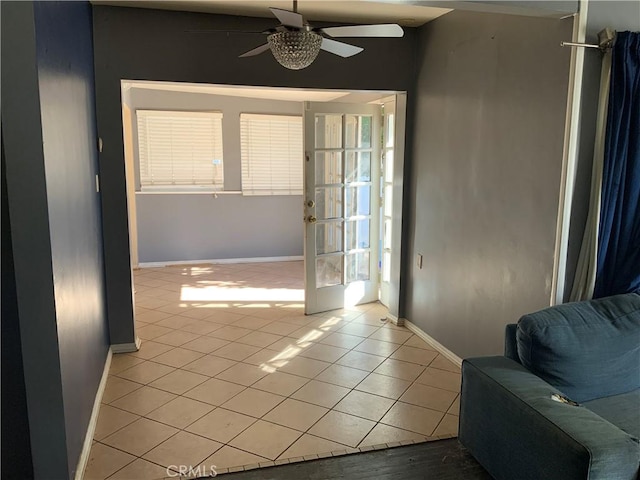 doorway featuring ceiling fan, french doors, and light tile patterned floors