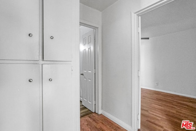 hallway featuring hardwood / wood-style flooring