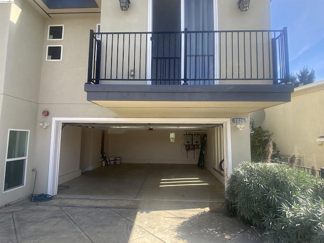 exterior space with a balcony and a garage