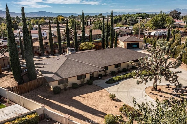 birds eye view of property with a mountain view