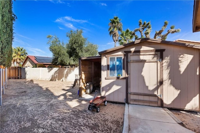 exterior space with a shed