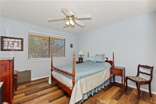 bedroom with ceiling fan and hardwood / wood-style floors