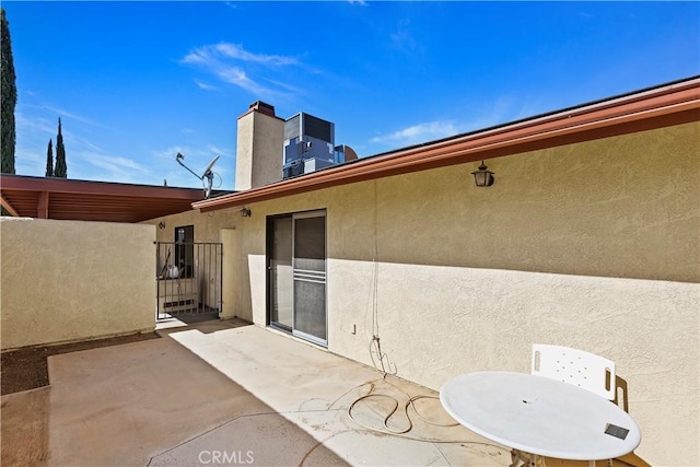 view of patio with central AC unit