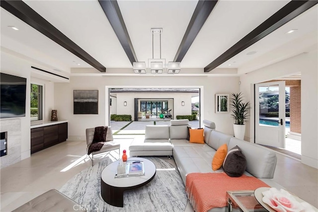 living room featuring beamed ceiling