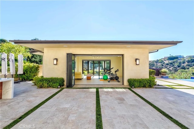 rear view of property with a mountain view