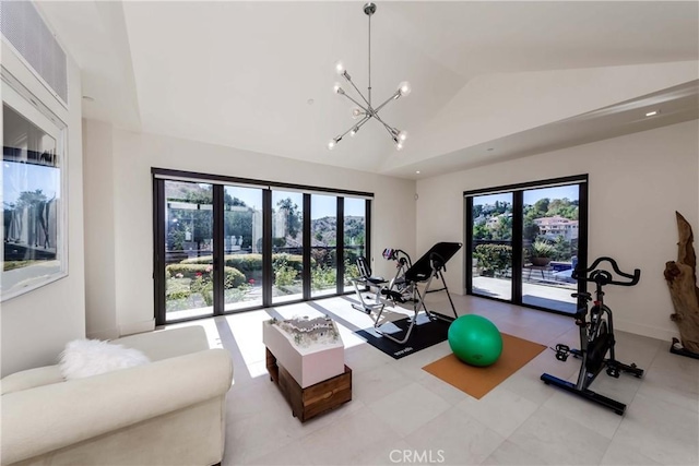 workout area featuring a chandelier and vaulted ceiling