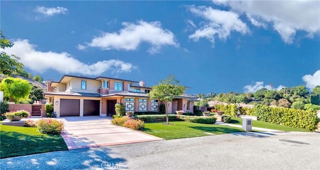 view of front of house with a front lawn and a garage