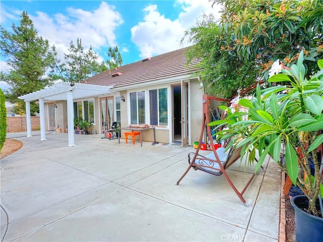 back of house featuring a patio area and a pergola