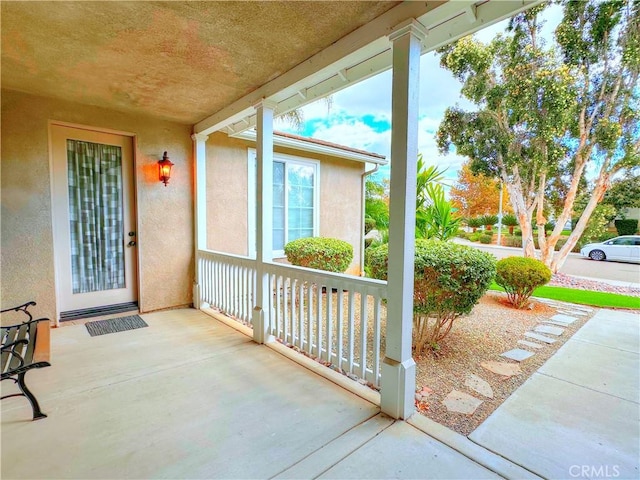 view of patio featuring a porch