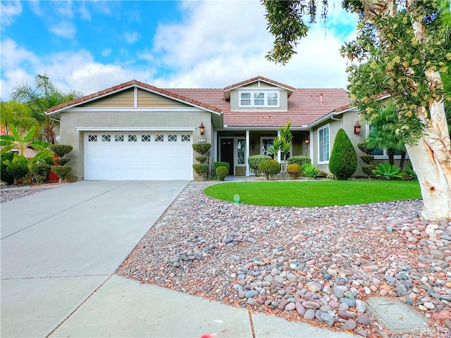 view of front of home featuring a garage and a front lawn