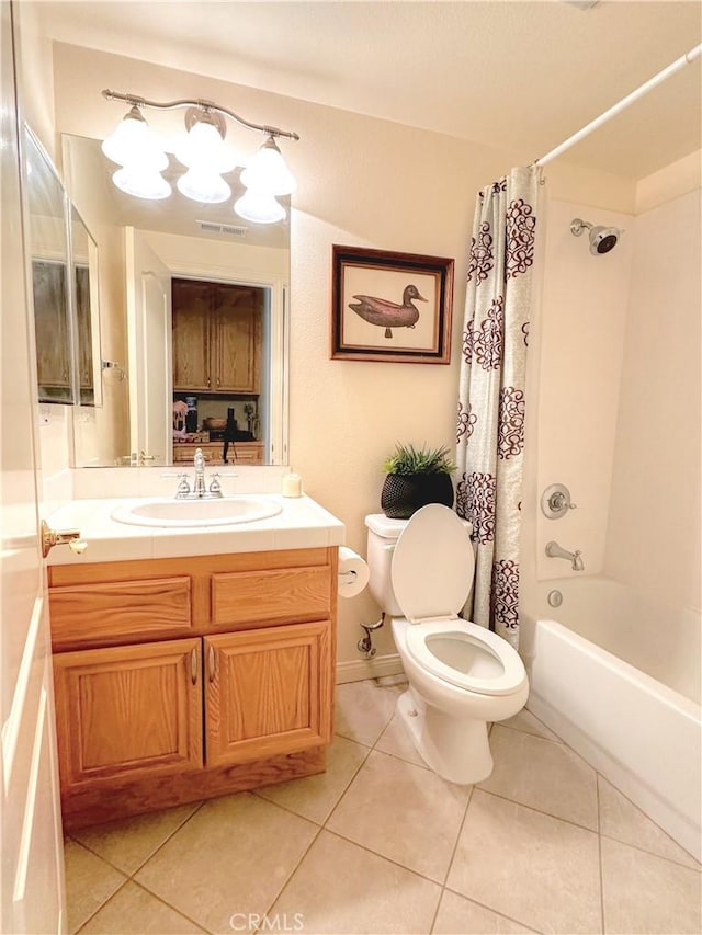 full bathroom with tile patterned floors, vanity, toilet, and shower / bathtub combination with curtain