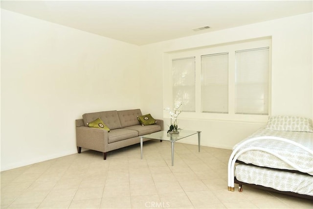 bedroom featuring light tile patterned flooring