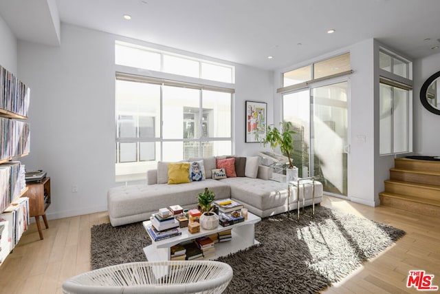 living room featuring plenty of natural light and light wood-type flooring