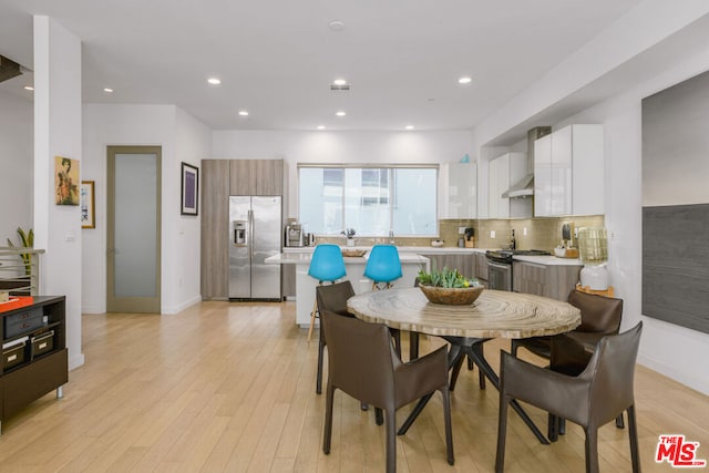 dining area with light hardwood / wood-style flooring