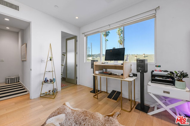 office space with light wood-type flooring