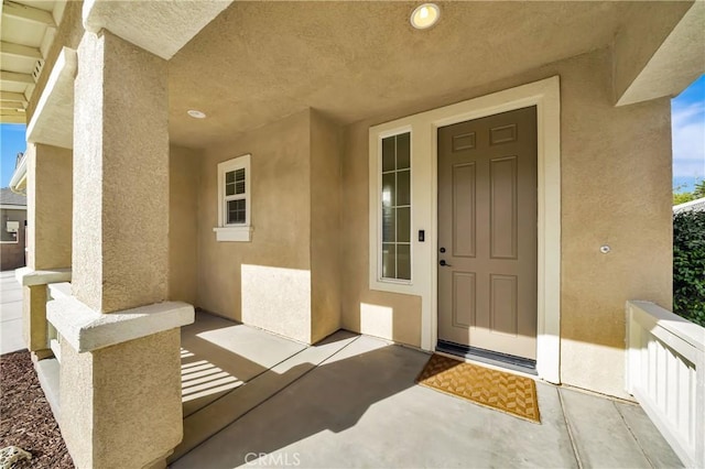 doorway to property with covered porch