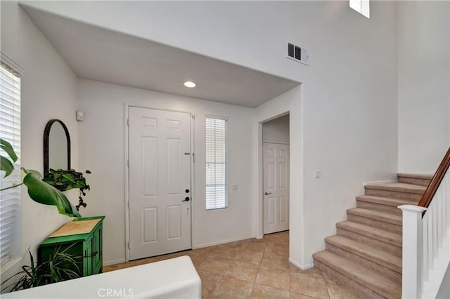 foyer entrance featuring light tile patterned floors