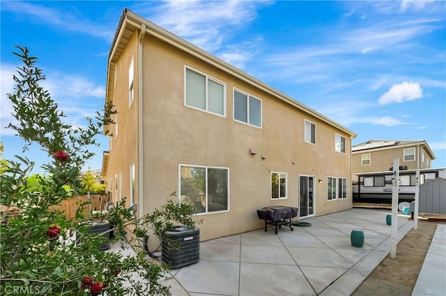 back of house with a patio