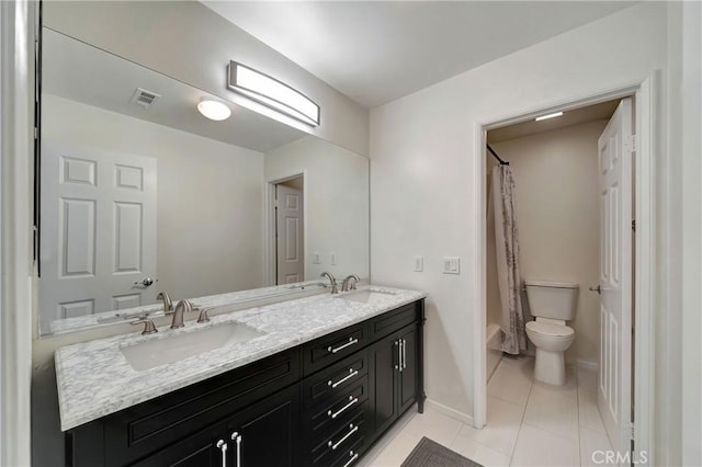 full bathroom with tile patterned floors, vanity, toilet, and shower / bath combo