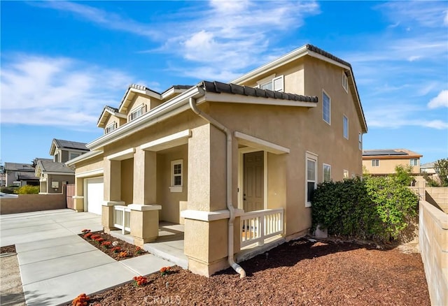 view of side of property featuring a garage