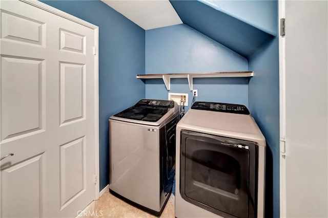 clothes washing area featuring washer and dryer