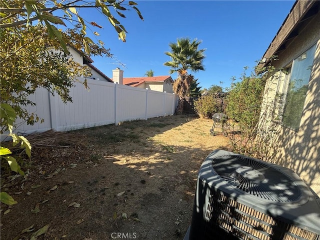 view of yard featuring central AC unit