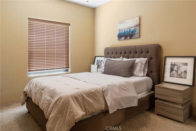 bedroom with light colored carpet