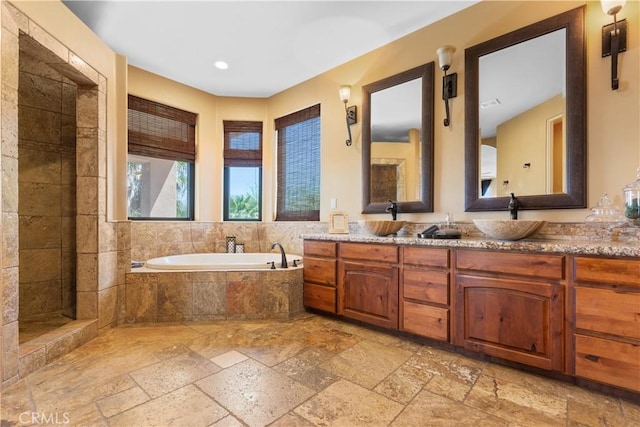 bathroom with vanity and plus walk in shower