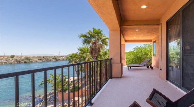 balcony featuring a water view