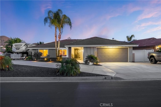 single story home with a garage